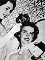 Miss Universe 1952, Armi Kuusela of Finland is crowned by actress Piper Laurie