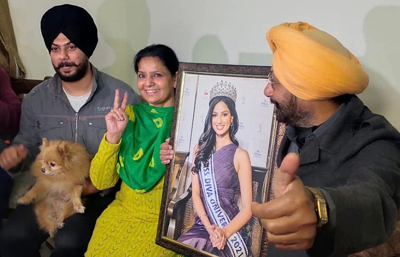 Harnaaz Sandhu's family from left to right - brother Harnoor holding pet dog Roger, mother Ravinder and father P.S. Sandhu