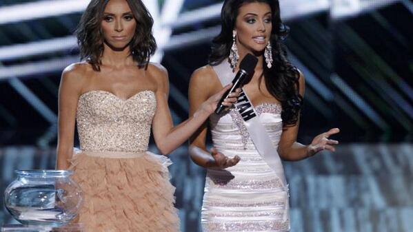 Guiliana Rancic holds the microphone for Miss Utah USA, Marissa Powell as she answers her question
